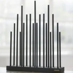 Elflugan elljusstake, Kolsvart