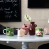 Tofslan & Vifslan röd rubin Muminmugg, grön